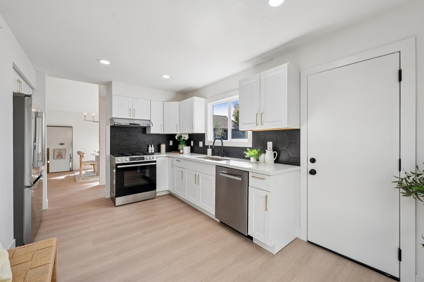 Staged kitchen with black hexagon tile backsplash, terracotta remodel in Petaluma