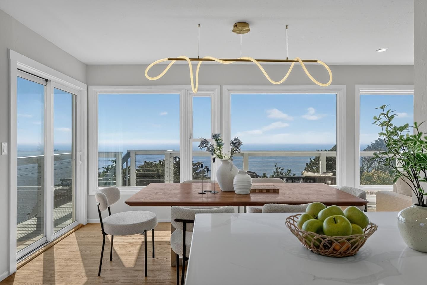 Dining room with brass pendant and ocean view, coastal modern in Daly City
