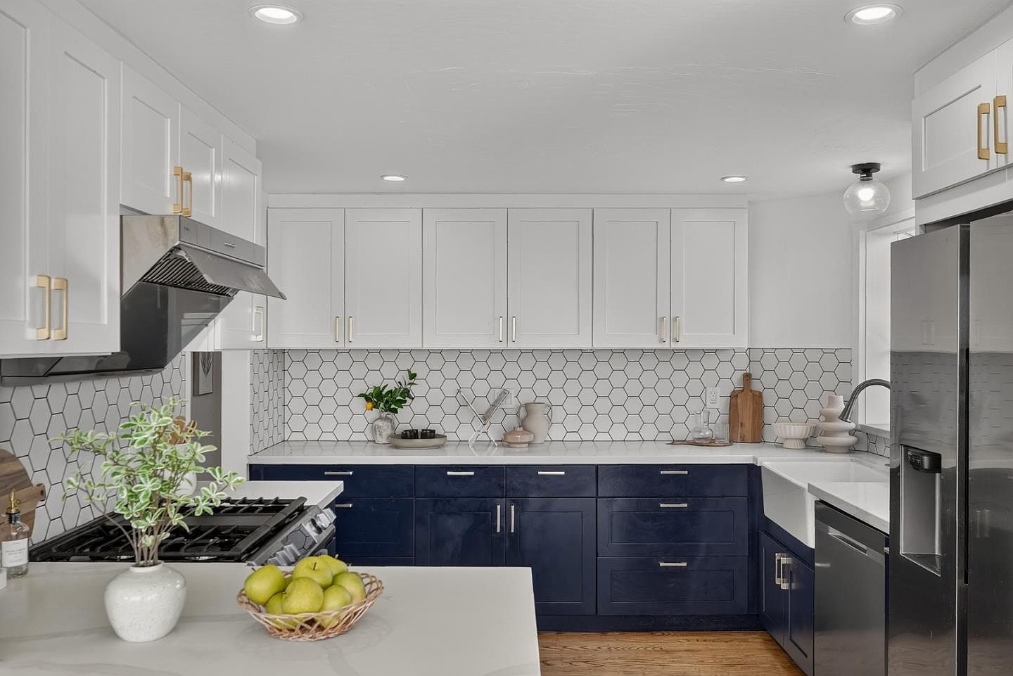 Staged kitchen with navy cabinetry and hex tile, coastal modern in Daly City