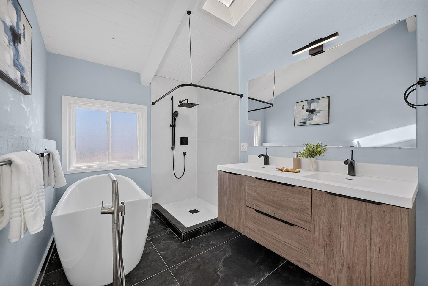Primary bathroom with soaking tub and skylight, coastal modern in Daly City